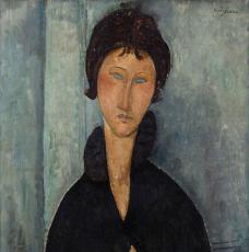 Portrait de femme aux yeux bleus avec un manteau noir