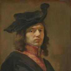 un homme de 3/4 avec un béret